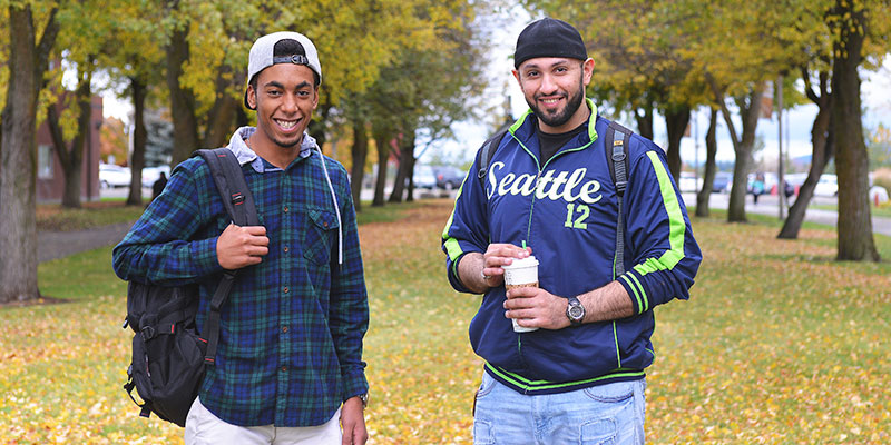 Two students smiling in the fall st SFCC.